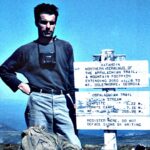 World War II veteran Earl Shaffer stands on the summit of Katahdin at the end of his 1948 thru-hike, becoming the first known A.T. thru-hiker.