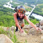 Hiker climbing rocks.