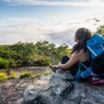 A hiker looks over the landscape surround the Appalachian Trail on Blood Mountain, Georgia