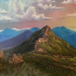 Painting of a grassy-covered brown mountain with blue mountains in the distance and pink and yellow sky with puffy white clous.
