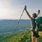 Backpacker celebrating a beautiful Appalachian Trail view.