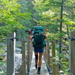 Appalachian Trail Hiker on a Bridge in New Hampshire. Photo by Austin "UFC Guy" King.