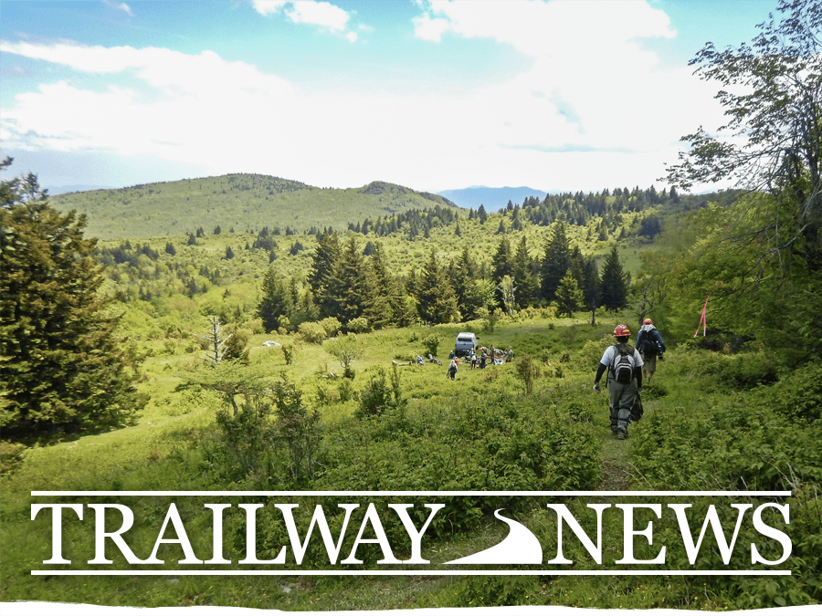 Trailway News header - January 20, 2023. Image shows a Trail Crew walking down a grassy hill towards a work truck.