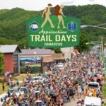 The Hiker Parade at Appalachian Trail Days 2022, with Trail Days Logo