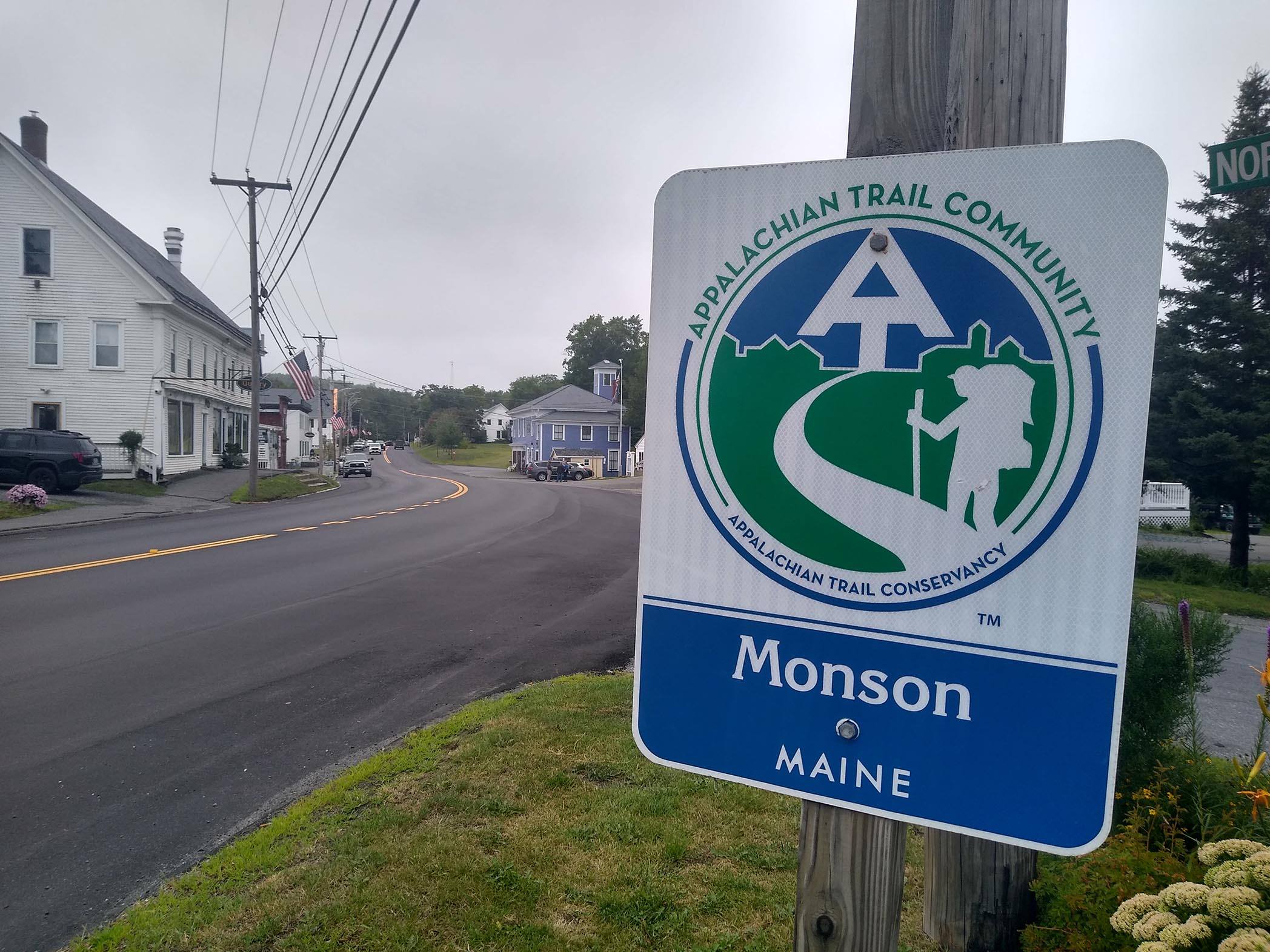 Sign on roadside with A.T. Community logo