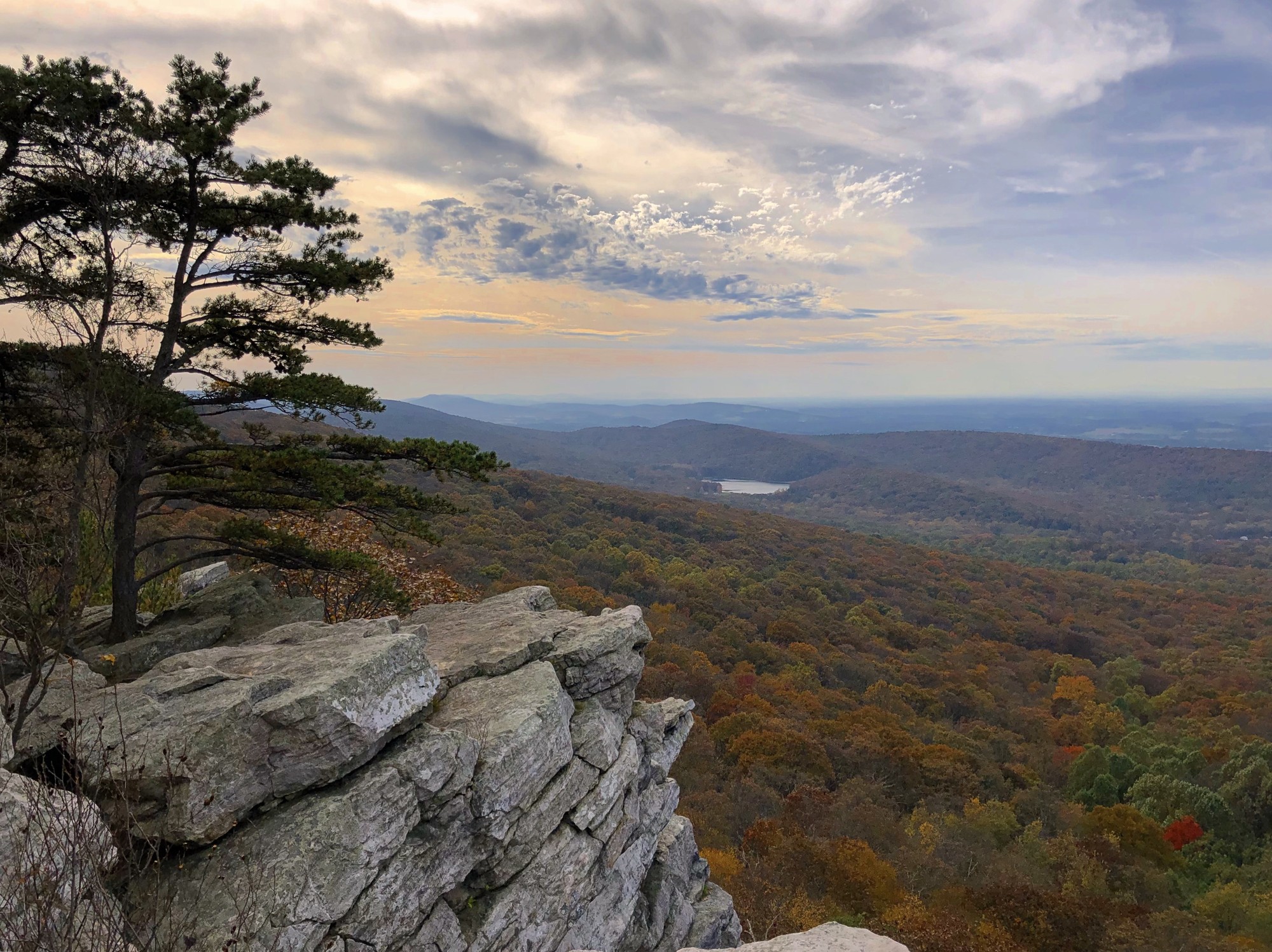 Scenic view of landscape with rocky outcropping in foreground