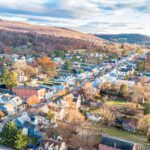 An aerial photo of the main street running through a small town