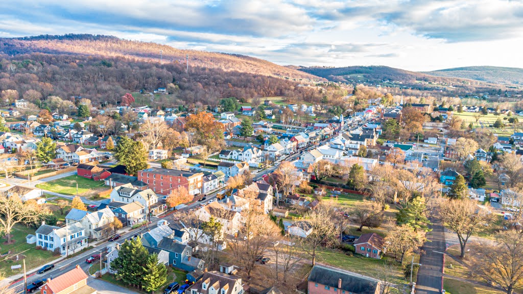 An aerial photo of the main street running through a small town