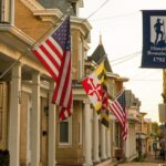 Town street with US and Maryland flags adorning storefronts