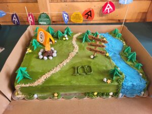 A festive birthday cake celebrating 100 years of the Appalachian Trail Conservancy