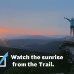 Female hiker with arms outstretched watches sunset from McAfee Knob. Text overlay reads "Watch the sunset from the Trail" next to a checkbox.
