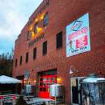 Side of red brick Smoketown Brewing building