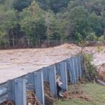 Floodwaters sweeping away the Chestoa Bridge during Hurricane Helene.