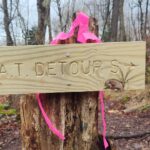 New wooden sign reading “A.T. Detour S” with an arrow pointing the direction of the detour.