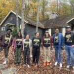 Hudson Brock (right) poses with ELS participants all wearing matching HMBLE HSTLE Appalachian Trail t-shirts outside Kittatinny Hall.