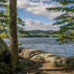 Lake surrounded by rolling, forested mountains in Sterling Forest State Park.