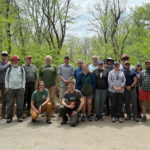 Group of 20 ATLP meeting attendees poses for a photo along the Appalachain Trail.