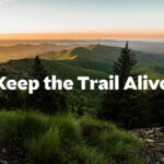 A sunset view of the Appalachian Mountains along the Appalachian Trail, with a text overlay that reads "Keep the Trail Alive."