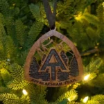 Wooden Appalachian Trail marker ornament with A.T. monogram and pine trees.