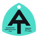 Cyan A.T. hangtag with black A.T. symbol.