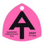 Hot pink A.T. hangtag with black A.T. symbol.