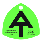 Neon green A.T. hangtag with black A.T. symbol.