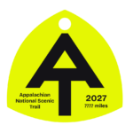 Neon yellow A.T. hangtag with black A.T. symbol.