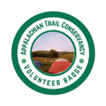 A.T. management volunteer badge graphic